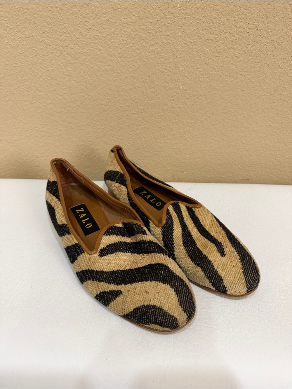 Zalo Zebra-Print Slip-On Flats in Black and Beige